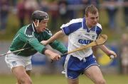 11 April 2004; Eoin Kelly of Waterford is tackled by Ollie Moran of Limerick during the Allianz Hurling League Division 1 Group 1 match between Waterford and Limerick at Walsh Park in Waterford. Photo by Matt Browne/Sportsfile