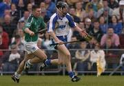 11 April 2004; John Mullane of Waterford in action against Brian Carroll of Limerick during the Allianz Hurling League Division 1 Group 1 match between Waterford and Limerick at Walsh Park in Waterford. Photo by Matt Browne/Sportsfile