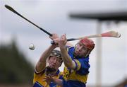 11 April 2004; Niall Gilligan of Clare in action against John Devane of Tipperary during the Allianz Hurling League Division 1 Group 1 match between Clare and Tipperary at Cusack Park in Ennis, Clare. Photo by Ray McManus/Sportsfile