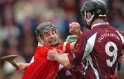 11 April 2004; Paul Tierney of Cork in action against Tony Og Regan of Galway during the Allianz Hurling League Division 1 Group 1 match between Galway and Cork at Pearse Stadium in Galway. Photo by David Maher/Sportsfile