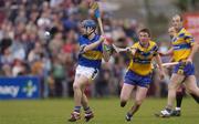 11 April 2004; Paul Kelly of Tipperary clears under pressure from Diarmuid McMahon of Clare during the Allianz Hurling League Division 1 Group 1 match between Clare and Tipperary at Cusack Park in Ennis, Clare. Photo by Ray McManus/Sportsfile