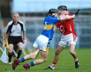 14 July 2007; Alan Byrne, Tipperary, holds off the challenge of Ben O'Connor, Cork. Guinness All-Ireland Hurling Championship Qualifier, Group B, Tipperary v Cork, Semple Stadium, Thurles, Co. Tipperary. Picture credit: Brendan Moran / SPORTSFILE