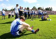 15 July 2007; Monaghan's Dessie Mone sits dejected with his team-mates after the game. Bank of Ireland Ulster Senior Football Championship Final - Tyrone v Monaghan, St Tighearnach's Park, Clones, Co Monaghan. Picture credit: Oliver McVeigh / SPORTSFILE