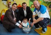 18 July 2007; Cian Ahearn, 11 months, from Dolphin's Barn, Dublin, with Dublin footballers, from left, Jason Sherlock, Ciaran Whelan and Shane Ryan, and the Delany Cup, on a visit to Children's University Hospital, Temple Street, Dublin. Picture credit: Caroline Quinn / SPORTSFILE