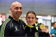 25 November 2014; Team Ireland's Katie Taylor with coach and father Pete Taylor pictured in Dublin Airport on their return from the 2014 AIBA Elite Women's World Boxing Championships in Jeju, Korea. Dublin Airport, Dublin. Picture credit: Barry Cregg / SPORTSFILE