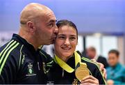 25 November 2014; Team Ireland's Katie Taylor with coach and father Pete Taylor pictured in Dublin Airport on their return from the 2014 AIBA Elite Women's World Boxing Championships in Jeju, Korea. Dublin Airport, Dublin. Picture credit: Barry Cregg / SPORTSFILE