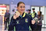25 November 2014; Team Ireland's Katie Taylor pictured in Dublin Airport on her return from the 2014 AIBA Elite Women's World Boxing Championships in Jeju, Korea. Dublin Airport, Dublin. Picture credit: Barry Cregg / SPORTSFILE