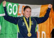 25 November 2014; Team Ireland's Katie Taylor pictured with her gold medal in Dublin Airport on her return from the 2014 AIBA Elite Women's World Boxing Championships in Jeju, Korea. Dublin Airport, Dublin. Picture credit: Barry Cregg / SPORTSFILE