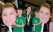 25 November 2014; Gearóid, left, age 9, and Sean Murphy, age 8, from Greystones, Co. Wicklow, pictured with Katie Taylor in Dublin Airport on her return from the 2014 AIBA Elite Women's World Boxing Championships in Jeju, Korea. Dublin Airport, Dublin. Picture credit: Barry Cregg / SPORTSFILE