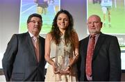 26 November 2014; Maria O'Sullivan, Trinity College Dublin, receives the Female University Athlete of the Year award from John Foley, CEO of Athletics Ireland, left, and Cyril Smyth, during the National Athletics Awards. Crowne Plaza Hotel, Santry, Co. Dublin. Picture credit: Barry Cregg / SPORTSFILE