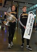 27 November 2014; Kerry's Donnchadh Walsh, carrying the Sam Maguire Cup, with James O'Donoghue at Dublin Airport ahead of their trip to Boston for the GAA / GPA Opel All Star Tour 2014. Opel Ireland is the official car partner of the GAA and GPA. For more information check out www.opel.ie #OpelAllStarTour. Dublin Airport, Dublin. Picture credit: Pat Murphy / SPORTSFILE