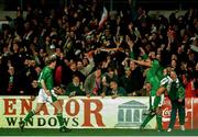 15 February 1995; Terry Phelan, right, and Steve Staunton, left, celebrate with David Kelly, after he scored the Republic of Ireland's first goal against England. The match was subsequently abandoned after rioting broke out the the Upper West Stand. International Friendly, Republic of Ireland v England, Lansdowne Road, Dublin. Picture credit; Ray McManus / SPORTSFILE