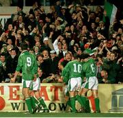 15 February 1995; The Republic of Ireland team celebrate after their first goal against England, scored by David Kelly. The match was subsequently abandoned after rioting broke out the the Upper West Stand. International Friendly, Republic of Ireland v England, Lansdowne Road, Dublin. Picture credit; Ray McManus / SPORTSFILE