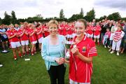 15 July 2007; Uachtaran Cumann Peil Gael na mBan Geraldine Giles presents the cup to Cork captain Roisin O'Sullivan. TG4 Ladies All-Ireland Minor Football Final, Dublin v Cork, JJ Brackens GAA Club, Templemore, Co. Tipperary. Picture credit: Kieran Clancy / SPORTSFILE