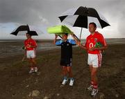 17 July 2007; Dublin footballer Jason Sherlock, Cork hurler Tom Kenny, left, and Cork footballer James Masters, who are three of those that were announced as Ariel GAA Championship Bright Ambassadors for 2007. This summer, Ariel is giving away free exclusive GAA towels with promotional packs. Martello Tower, Sandymount Strand, Dublin. Picture credit: Ray McManus / SPORTSFILE