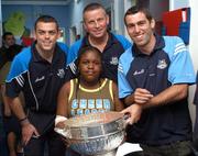 19 July 2007; Dublin players Paul Casey, left, David Henry, right, and manager Paul Caffrey, with Ada Okomah, age thirteen and a half, from Blanchardstown, Co. Dublin, on a visit to Our Lady's Children's Hospital, Crumlin, Dublin. Picture credit: Stephen McCarthy / SPORTSFILE