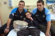 19 July 2007; Dublin players Paul Casey, left, and Daivd Henry, with Greg Mooney, age 12, from Lucan, Co. Dublin, on a visit to Our Lady's Children's Hospital, Crumlin, Dublin. Picture credit: Stephen McCarthy / SPORTSFILE