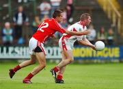 21 July 2007; Ray Finnigan, Louth, in action against Kevin McMahon, Cork. Bank of Ireland All-Ireland Senior Football Championship Qualifier, Round 3, Louth v Cork, O'Moore Park, Portlaoise, Co. Laois. Picture credit: Ray McManus / SPORTSFILE