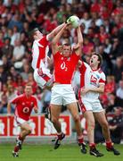 21 July 2007; Pearse O'Neill, Cork, in action against Paddy Keenan and Mick Fanning, Louth. Bank of Ireland All-Ireland Senior Football Championship Qualifier, Round 3, Louth v Cork, O'Moore Park, Portlaoise, Co. Laois. Picture credit: Ray McManus / SPORTSFILE