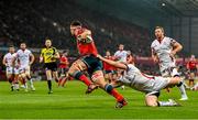 28 November 2014; Robin Copeland, Munster, goes over for his side's first try despite the tackle of Stuart Olding, Ulster. Guinness PRO12, Round 9, Munster v Ulster. Thomond Park, Limerick. Picture credit: Stephen McCarthy / SPORTSFILE