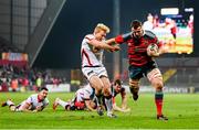 28 November 2014; Robin Copeland, Munster, on his way to scoring his side's first try despite the tackle of Stuart Olding, Ulster. Guinness PRO12, Round 9, Munster v Ulster. Thomond Park, Limerick. Picture credit: Stephen McCarthy / SPORTSFILE