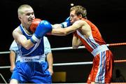 28 November 2014; Hughie Myers, Ireland, left, exchanges punches with Anthony Chapat, France, during their 49kg bout. Elite Boxing International, Ireland v France, National Stadium, Dublin. Picture credit: Ramsey Cardy / SPORTSFILE