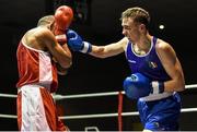 28 November 2014; Brendan Irvine, Ireland, right, exchanges punches with Jean-Michel Braganza, France, during their 49kg bout. Elite Boxing International, Ireland v France, National Stadium, Dublin. Picture credit: Ramsey Cardy / SPORTSFILE