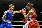 28 November 2014; Brendan Irvine, Ireland, left, exchanges punches with Jean-Michel Braganza, France, during their 49kg bout. Elite Boxing International, Ireland v France, National Stadium, Dublin. Picture credit: Ramsey Cardy / SPORTSFILE
