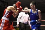 28 November 2014; Garry McKenna, Ireland, right, exchanges punches with Anthony Bret, France, during their 56kg bout. Elite Boxing International, Ireland v France, National Stadium, Dublin. Picture credit: Ramsey Cardy / SPORTSFILE