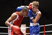 28 November 2014; Kurt Walker, Ireland, right, exchanges punches with Samuel Kistohurry, France, during their 56kg bout. Elite Boxing International, Ireland v France, National Stadium, Dublin. Picture credit: Ramsey Cardy / SPORTSFILE