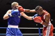 28 November 2014; Kurt Walker, Ireland, left, exchanges punches with Samuel Kistohurry, France, during their 56kg bout. Elite Boxing International, Ireland v France, National Stadium, Dublin. Picture credit: Ramsey Cardy / SPORTSFILE