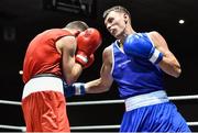 28 November 2014; Sean McComb, Ireland, right, exchanges punches with Maxime Devignaud, France, during their 60 bout. Elite Boxing International, Ireland v France, National Stadium, Dublin. Picture credit: Ramsey Cardy / SPORTSFILE