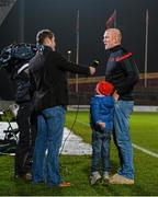 28 November 2014; Munster's Paul O'Connell is interviewed for BBC NI after the game as his four-year-old son, Paddy, stands on his &quot;tippy-toes&quot; to try get a better view of the action. Guinness PRO12, Round 9, Munster v Ulster, Thomond Park, Limerick. Picture credit: Diarmuid Greene / SPORTSFILE