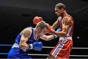 28 November 2014; Ross Hickey, Ireland, left, exchanges punches with Hassan Amzile, France, during their 64kg bout. Elite Boxing International, Ireland v France, National Stadium, Dublin. Picture credit: Ramsey Cardy / SPORTSFILE