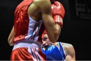 28 November 2014; Ross Hickey, Ireland, exchanges punches with Hassan Amzile, France, during their 64kg bout. Elite Boxing International, Ireland v France, National Stadium, Dublin. Picture credit: Ramsey Cardy / SPORTSFILE