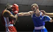 28 November 2014; Adam Nolan, Ireland, right, exchanges punches with Daouda Sangare, France, during their 69kg bout. Elite Boxing International, Ireland v France, National Stadium, Dublin. Picture credit: Ramsey Cardy / SPORTSFILE