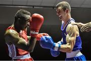 28 November 2014; Adam Nolan, Ireland, right, exchanges punches with Daouda Sangare, France, during their 69kg bout. Elite Boxing International, Ireland v France, National Stadium, Dublin. Picture credit: Ramsey Cardy / SPORTSFILE