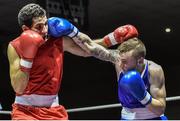 28 November 2014; Dean Walsh, Ireland, right, exchanges punches with Abdel Malik Ladjali, France, during their 64kg bout. Elite Boxing International, Ireland v France, National Stadium, Dublin. Picture credit: Ramsey Cardy / SPORTSFILE