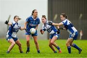 29 November 2014; Tricia Ni Mhorain, Clonbur, in action against Aisling Leonard, left, Eilish Lynch, centre, and Aine O'Connor, right, Castleisland Desmonds. TESCO HomeGrown Intermediate Ladies Football Club Championship Final, Castleisland Desmonds, Kerry v Clonbur, Galway. Corofin, Co. Clare. Picture credit: Diarmuid Greene / SPORTSFILE