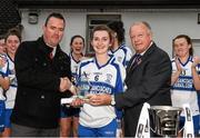29 November 2014; Cait Lynch, Castleisland Desmonds, is presented with the Player of the Match award by Ladies Gaelic Football Association president Pat Quill, right, and Paul O'Loughlin, from Tesco Ennis, left. TESCO HomeGrown Intermediate Ladies Football Club Championship Final, Castleisland Desmonds, Kerry v Clonbur, Galway. Corofin, Co. Clare. Picture credit: Diarmuid Greene / SPORTSFILE
