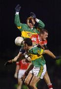 1 February 2003; Seamus Scanlon, back and John Sheehan, Kerry, contest a high ball with Cork's Brendan Jer O'Sullivan. National Football Leage Division 1A, Pairc Ui Rinn, Co. Cork. Picture credit; Ray McManus / SPORTSFILE