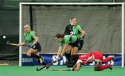 27 April 2006; From left, Catriona Carey, Bridget McKeever, Clare Parkhill and goalie Angela Platt, Ireland, in action against Korea. Ireland v Korea, Samsung Women's Hockey World Cup Qualifier, Pool B, Rome, Italy. Picture credit: SPORTSFILE