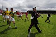 1 July 2007; The Cork and Kerry teams march behind the band during the pre-match parade. Bank of Ireland Munster Senior Football Championship Final, Kerry v Cork, Fitzgerald Stadium, Killarney, Co. Kerry. Picture credit: Ray McManus / SPORTSFILE