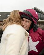 30 November 2014; Jockey Bryan Cooper receives a hug from trainer Sandra Hughes duaghter of the late Dessie Hughes in the winners enclosure after he rode her horse  Lieutenant Colonel to win The Bar One Racing Hatton`s Grace Hurdle. Horse Racing from Fairyhouse, Co. Meath Picture credit: Barry Cregg / SPORTSFILE