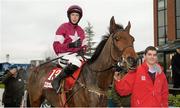 30 November 2014; Valseur Lido, with Bryan Cooper up, being lead into the winners enclosure after winning The Bar One Racing Drinmore Novice Steeplechase. Horse Racing from Fairyhouse, Co. Meath Picture credit: Barry Cregg / SPORTSFILE