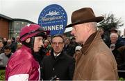 30 November 2014; Jockey Bryan Cooper speaking with trainer Willie Mullins after he rode Valseur Lido to win The Bar One Racing Drinmore Novice Steeplechase. Horse Racing from Fairyhouse, Co. Meath Picture credit: Barry Cregg / SPORTSFILE