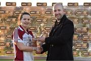 30 November 2014; Geraldine McLoughlin, Termon, is presented with the player of the match trophy by Shane Faherty from TESCO. TESCO HomeGrown All-Ireland Senior Club Championship Final, Termon, Donegal v Mourneabbey, Cork, Tuam Stadium, Tuam, Co. Galway. Picture credit: Matt Browne / SPORTSFILE