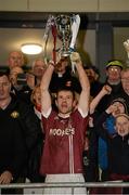 30 November 2014; Francis McEldowney, Slaughtneil, holds aloft the Seamus McFerran cup. AIB Ulster GAA Football Senior Club Championship Final, Omagh St Enda's v Slaughtneil, Athletic Grounds, Armagh. Picture credit: Oliver McVeigh / SPORTSFILE