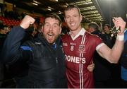 30 November 2014; Patsy Bradley, Slaughtneil, celebrates with a supporter after the game. AIB Ulster GAA Football Senior Club Championship Final, Omagh St Enda's v Slaughtneil, Athletic Grounds, Armagh. Picture credit: Oliver McVeigh / SPORTSFILE