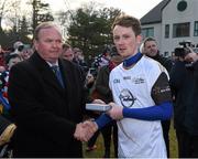 29 November 2014; Martin Dunne, Cavan, 2013 All Stars, is presented with a medal after the game by Uachtarán Chumann Lúthchleas Gael Liam Ó Néill. GAA GPA All Star Tour 2014, sponsored by Opel, 2013 All Stars v 2014 All Stars. Irish Cultural Centre, New Boston Dr, Canton, Massachusetts, USA. Picture credit: Ray McManus / SPORTSFILE